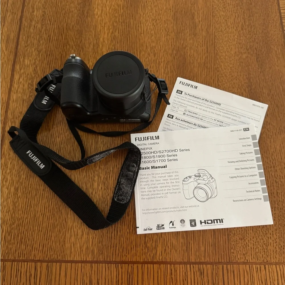 Fujifilm Black Digital Model S2550HD Camera with Zoom Lens and Ergonomic Grip.